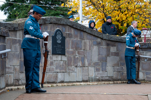 People pay respects outside the North Delta Recreation Centre for the Remembrance Day Ceremony.