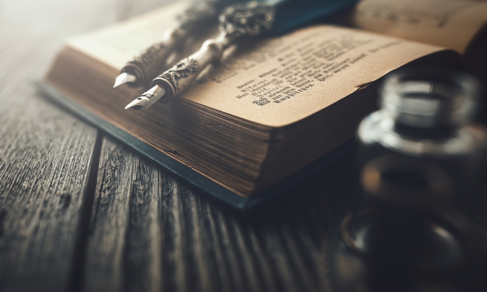 Quill Pen on an opened book