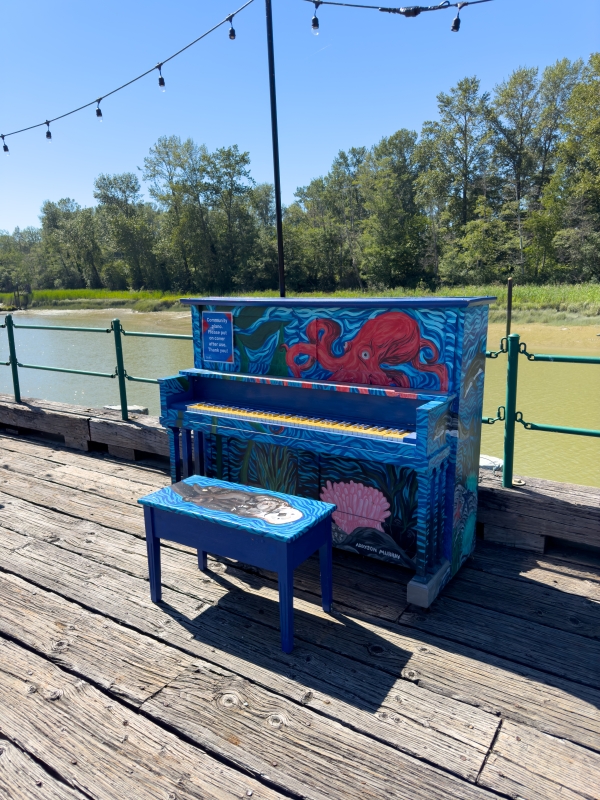 The painted piano site on the Elliott Street Wharf on a beautiful summer's day.