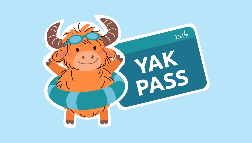 the new YAK Pass mascot, a yak, wearing a pair of goggles on his forehead and a flotation device around his waist.. 