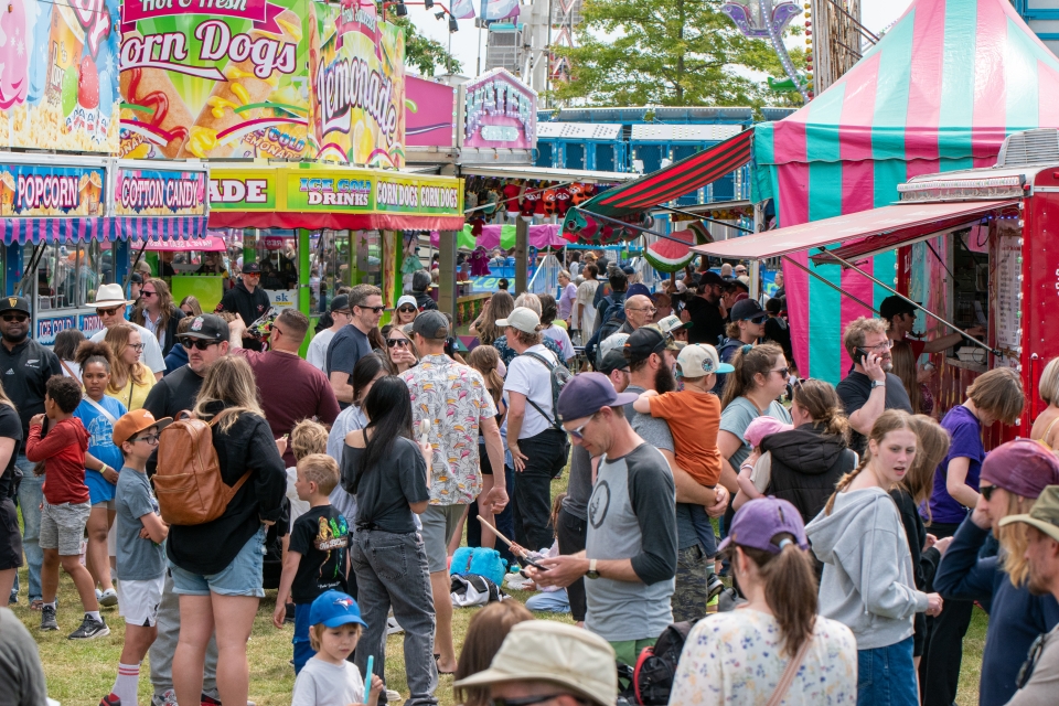 Crowds gather at the booths at the 2025 May Days.