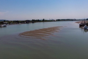 fishing boat stuck on sediment build-up